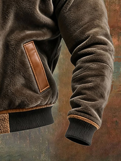 Veste chaude en tissu duveteux et cuir, poche en cuir marron, poignets côtelés.