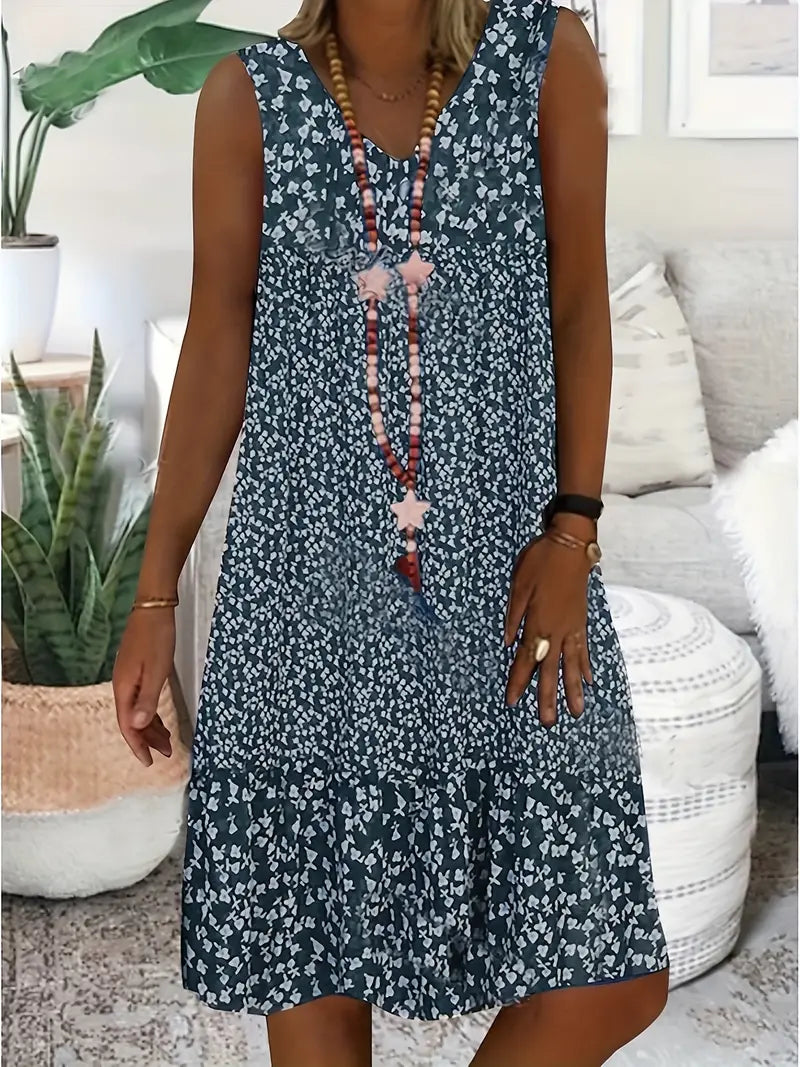 Robe sans manches encolure V, motif fleurs bleu foncé, boutonnière rose.