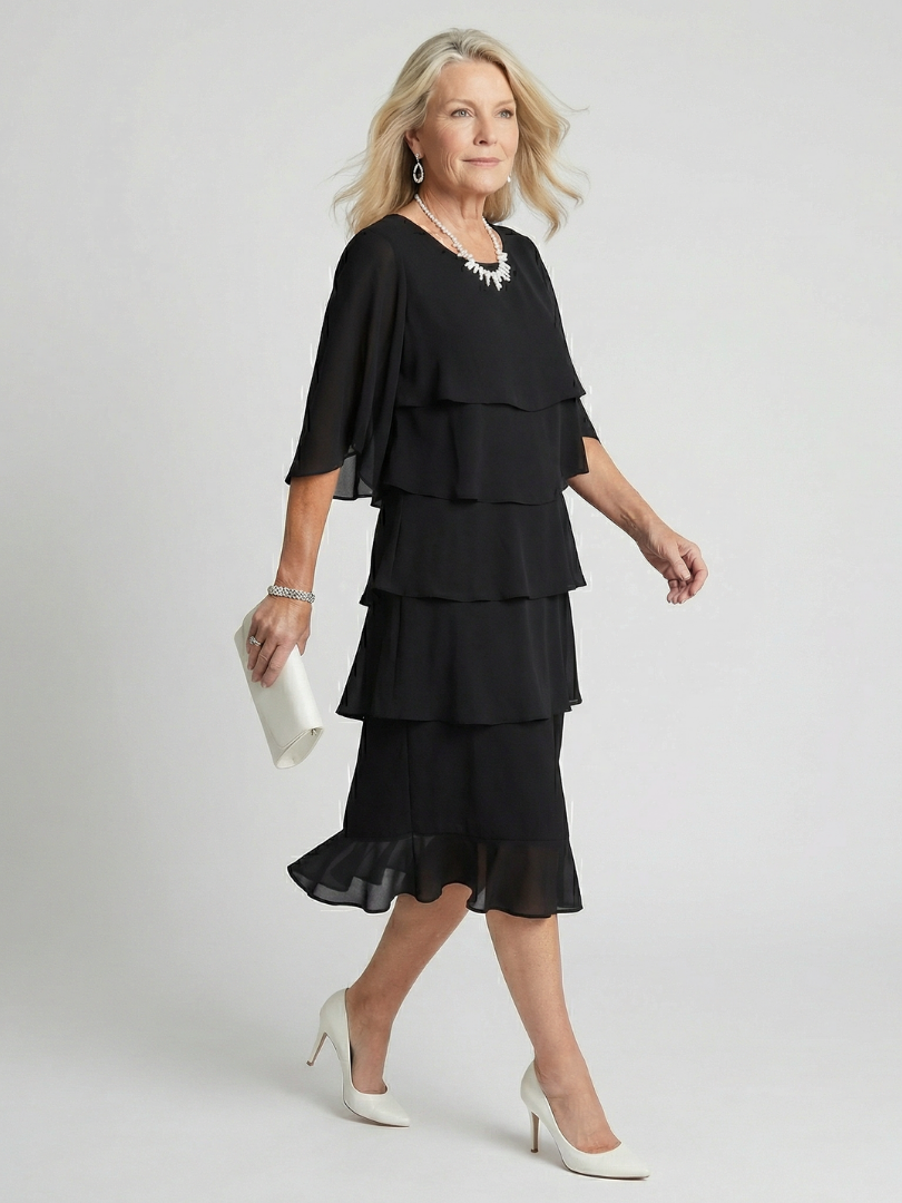 Robe midi noire étagée à volants, manches trois-quarts évasées, silhouette fluide