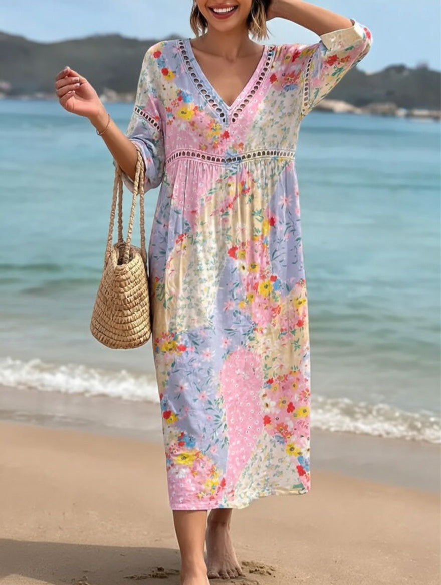 Robe fluide mi-longue à encolure V, manches 3/4, imprimé floral multicolore.