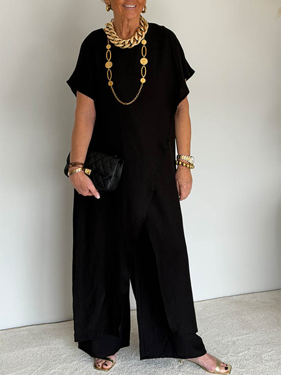 Tenue ample asymétrique noire, robe longue fendue devant et pantalon ample