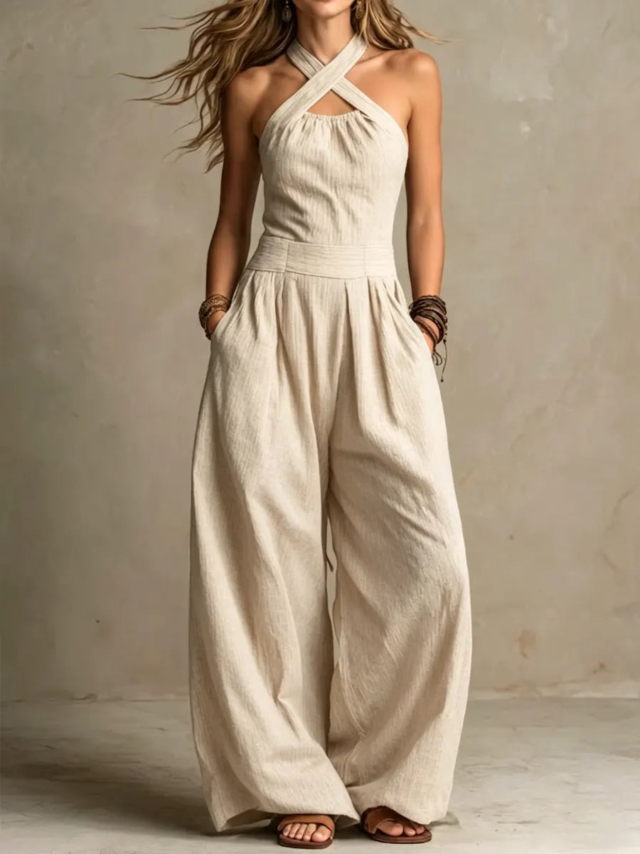 Combinaison pantalon beige à encolure croisée, bretelles croisées et jambes amples