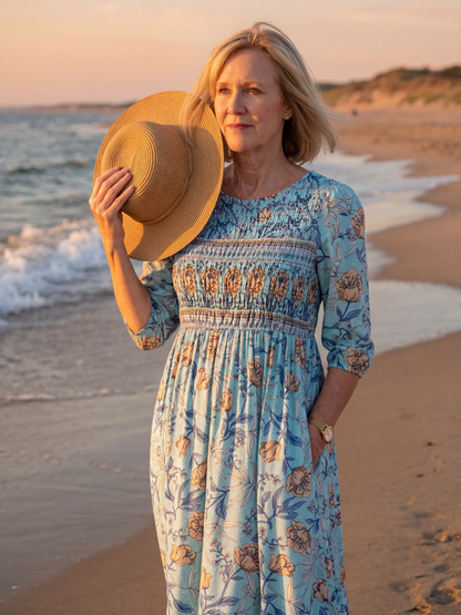 Robe midi bleue à fleurs, manches trois-quarts, taille froncée, col rond