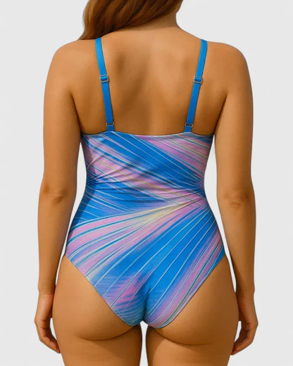 Maillot de bain une pièce rayé bleu et rose, bretelles fines, dos nageur échancré.