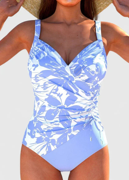 Maillot de bain Sorynelle bleu et blanc à motifs floraux, décolleté croisé.
