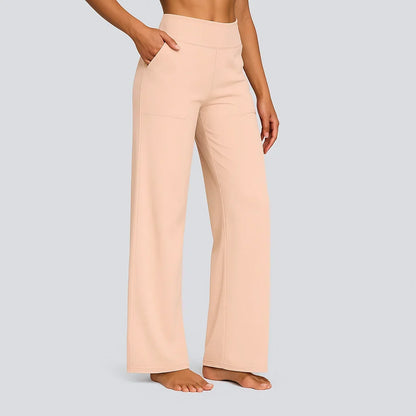 Pantalon stretch abricot clair, taille haute, jambe ample.