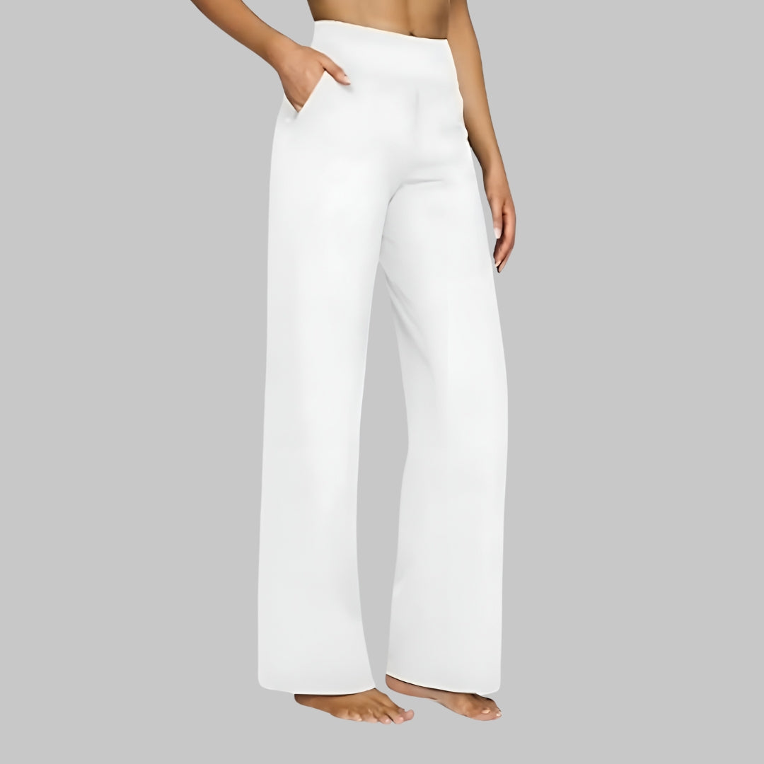 Pantalon blanc à jambe ample, taille mi-haute, poches latérales, finition propre