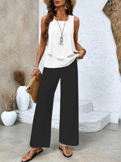 Ensemble estival blanc et noir : haut à volants blanc et pantalon large noir