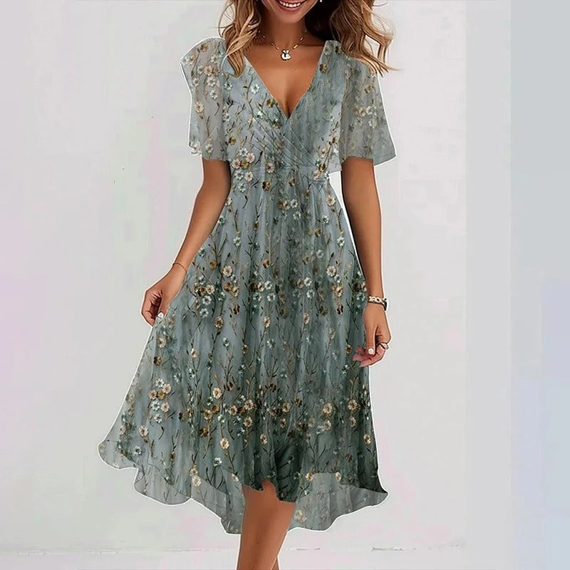 Robe mi-courte vert clair à petites fleurs, manches courtes, décolleté en V