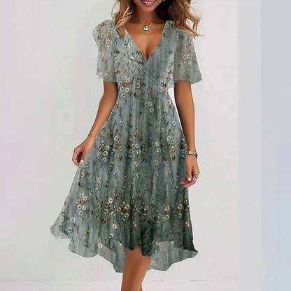 Robe mi-courte vert clair à petites fleurs, manches courtes, décolleté en V