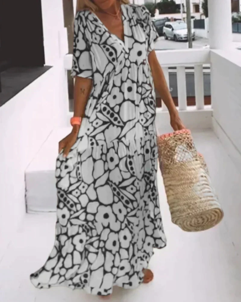 Robe d’été légère noire à motif géométrique, col en V, manches courtes, fluide.