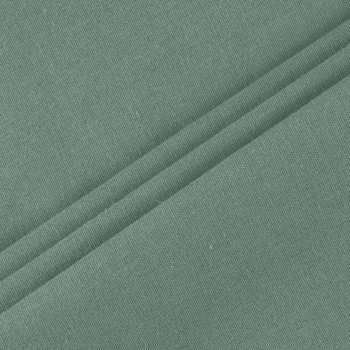 Tissu vert pour robe légère, surface texturée et uniforme, gros plan
