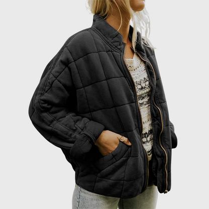 Veste matelassée oversize noire, col montant zippé, poches sur les côtés