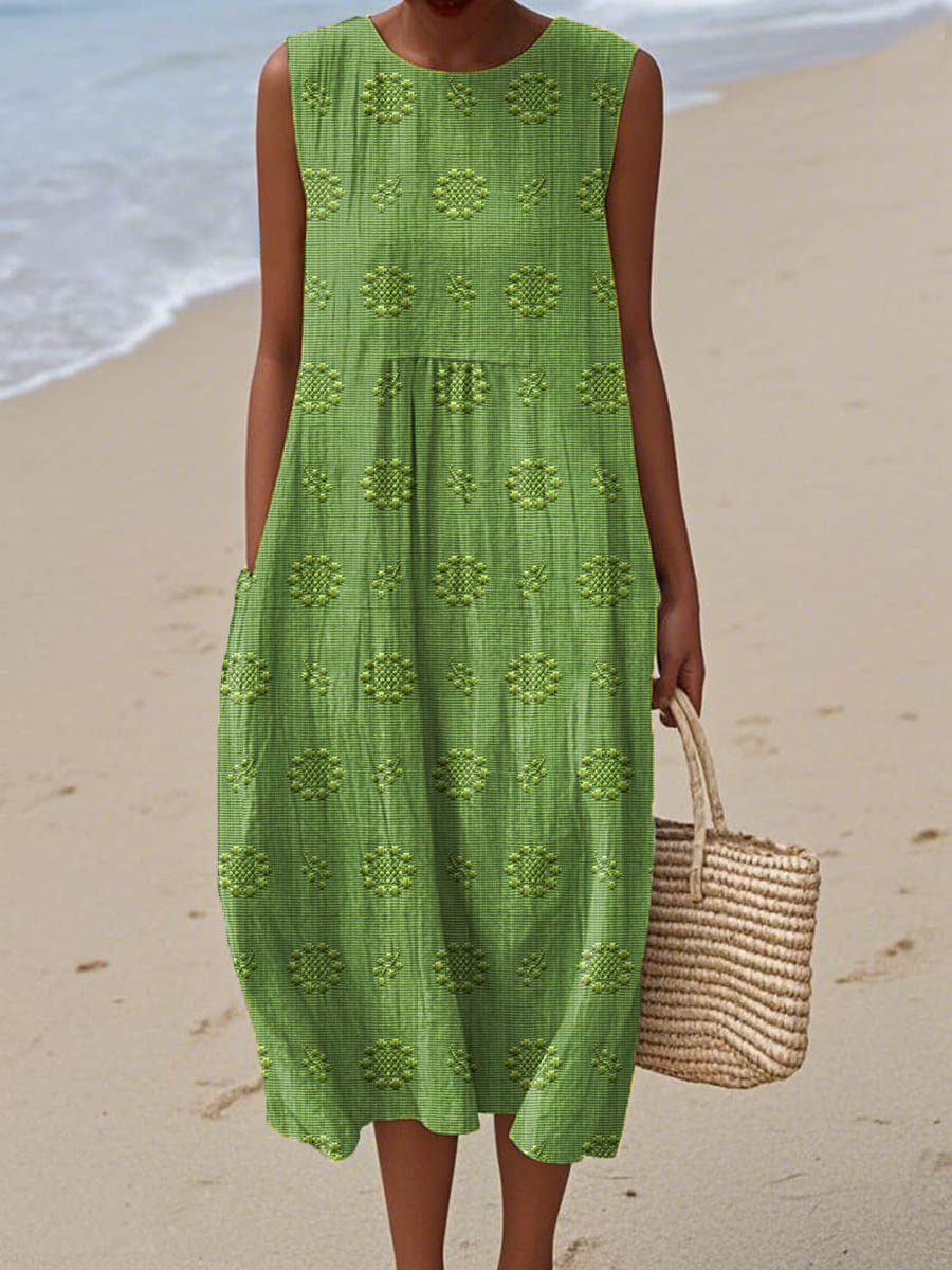 Robe d’été sans manches verte à broderies ajourées, base évasée et volants