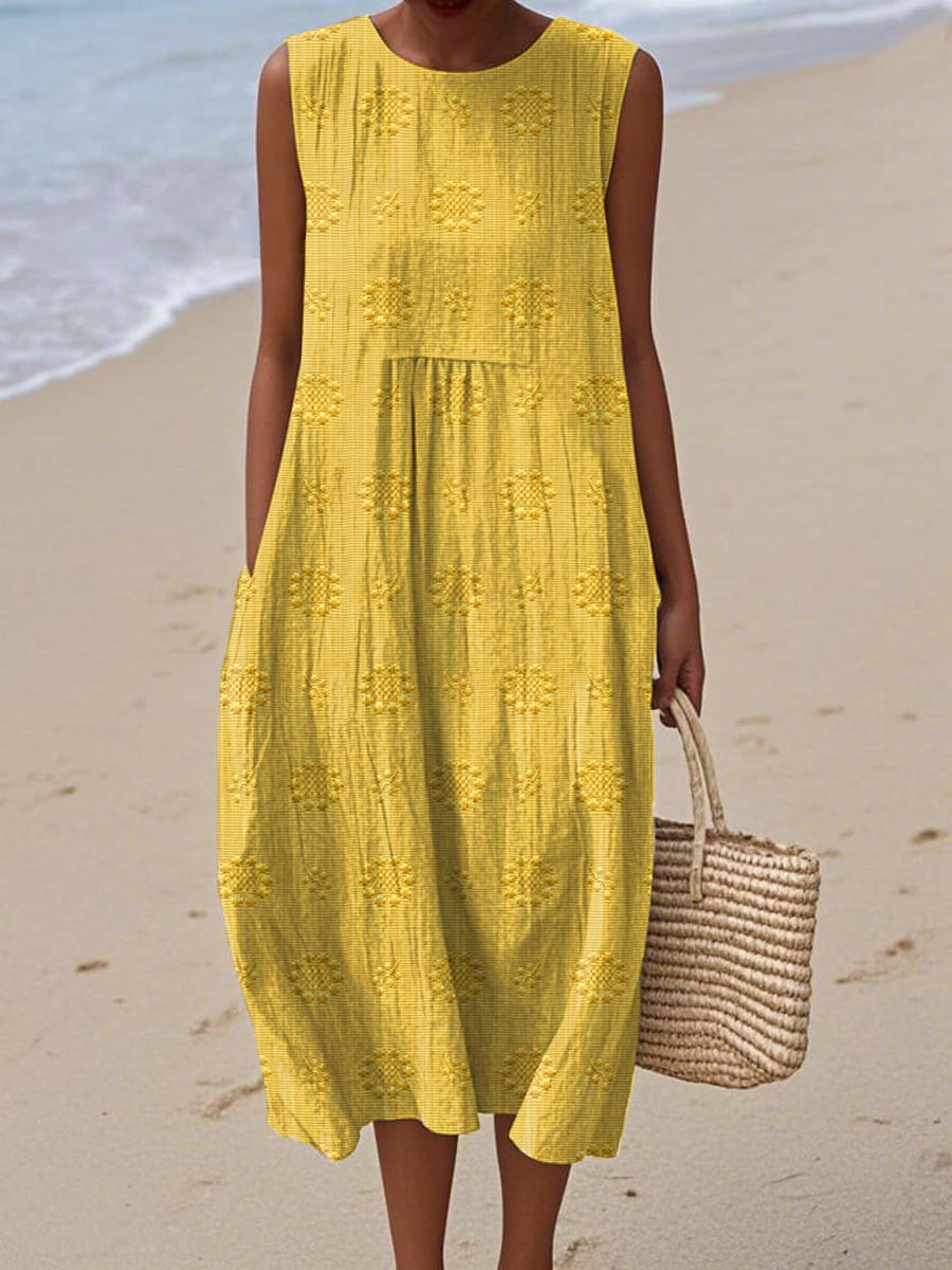 Robe d’été sans manches jaune moutarde à broderies ajourées et volants