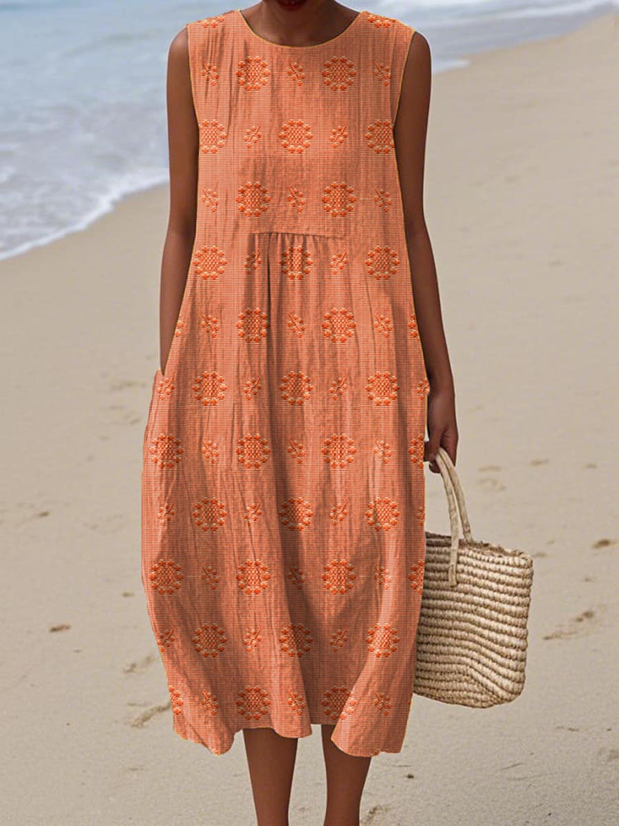 Robe d’été sans manches orange à broderies ajourées, empiècements volantés
