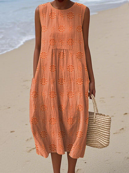 Robe d’été sans manches orange à broderies ajourées, empiècements volantés