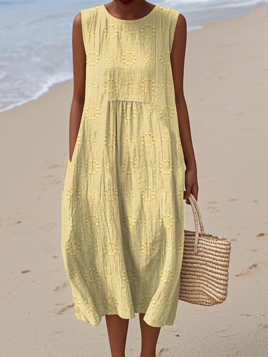 Robe d’été sans manches jaune à broderies ajourées et empiècement volanté
