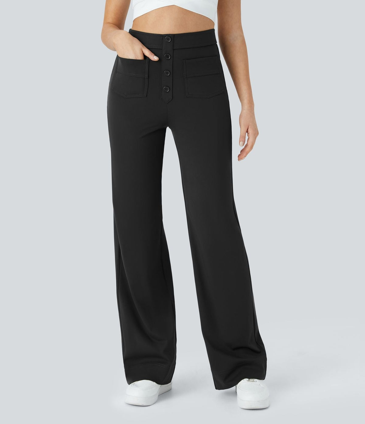 Pantalon élastique taille haute noir, poches avant, boutons devant, jambes larges