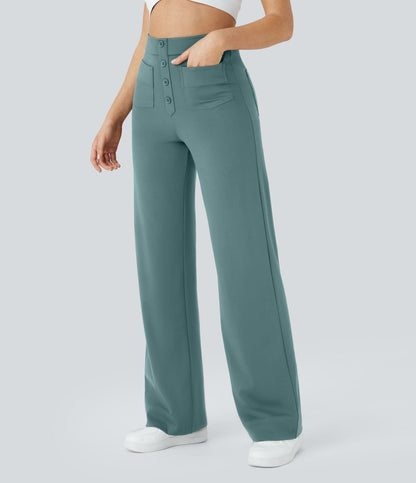 Pantalon bleu-vert à taille élastique, boutonnière décorative et poches avant