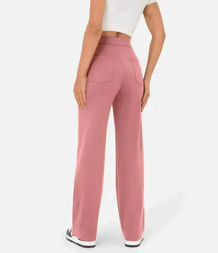 Pantalon élastique taille haute rose poudré, jambes droites larges, poches avant