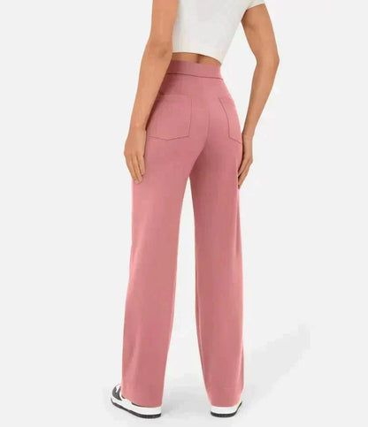 Pantalon élastique taille haute rose poudré, jambes droites larges, poches avant