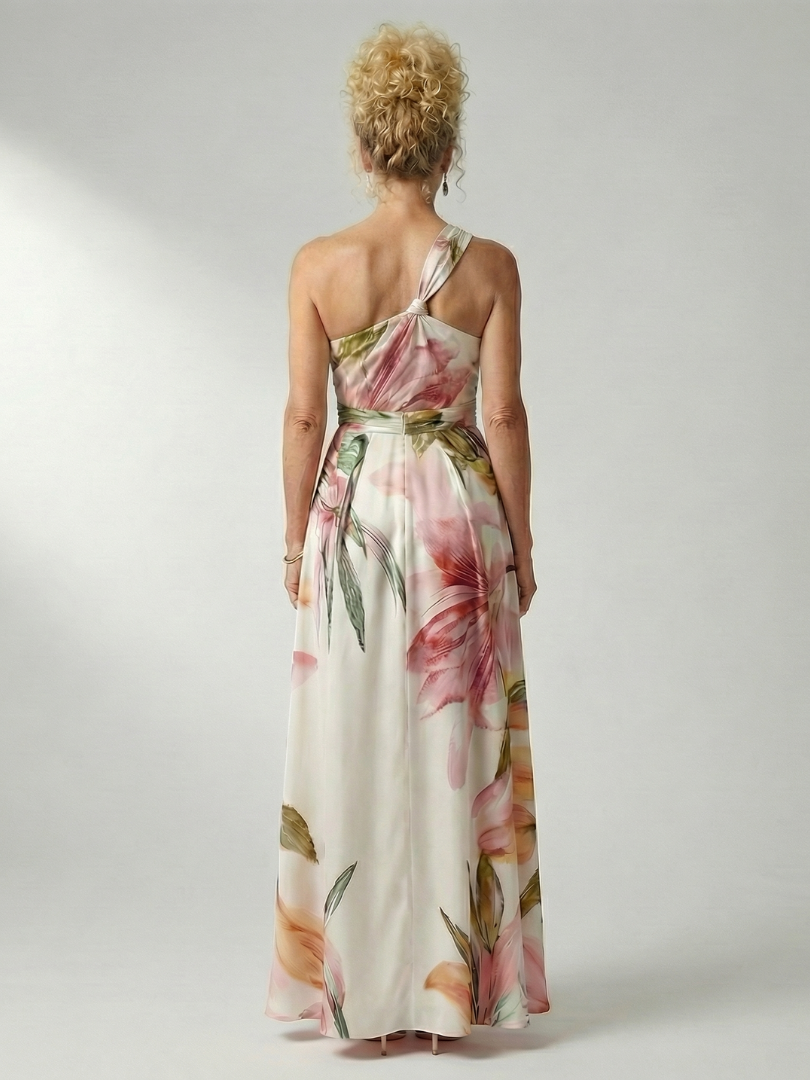 Robe longue fluide rose à fleurs, dos nu avec bride nouée au cou