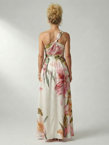 Robe longue fluide rose à fleurs, dos nu avec bride nouée au cou