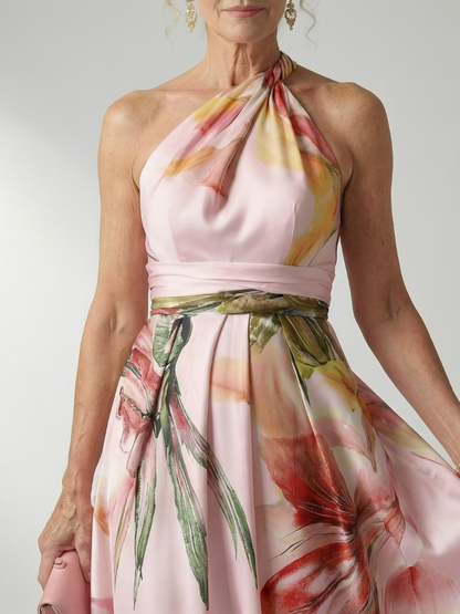 Robe longue rose satin, encolure licou nouée, ceinture et imprimé floral