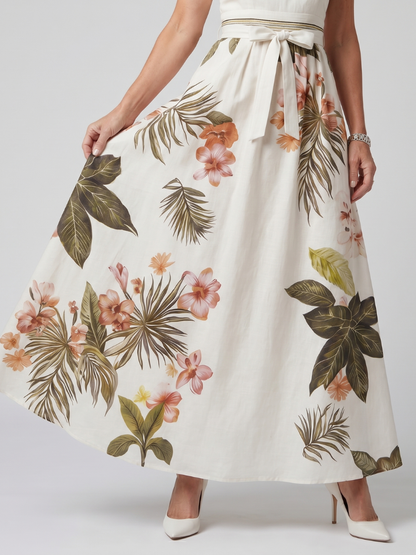 Robe longue drapée blanche à imprimé fleurs et feuilles, taille froncée