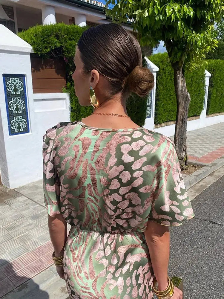 Robe midi à motif rose et vert, dos échancré et manches bouffantes, taille froncée
