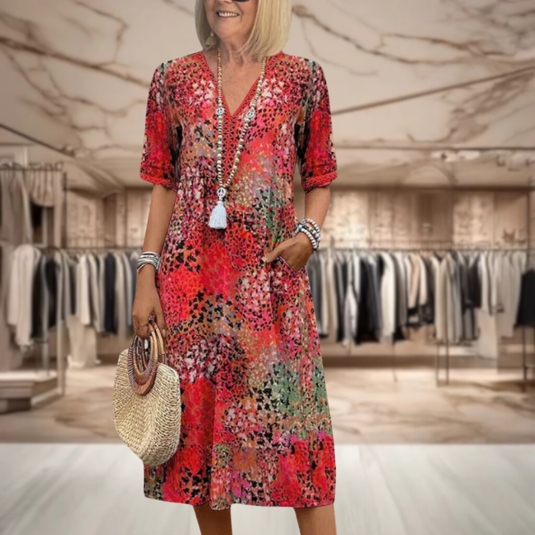 Robe mi-longue col V, manches courtes, motif multicolore sur fond rouge