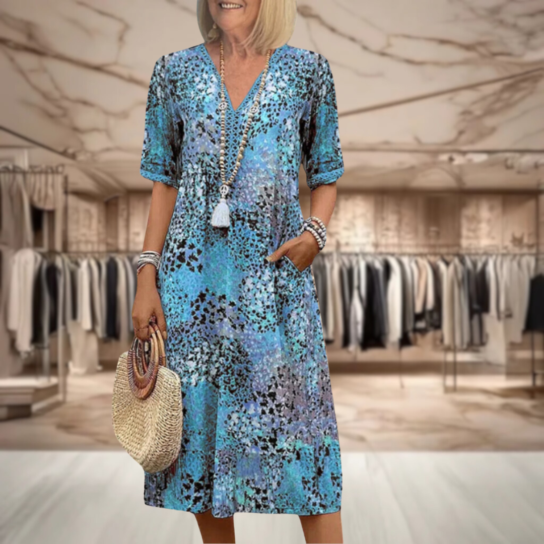 Robe mi-longue col V, manches courtes, motif multicolore sur fond bleu