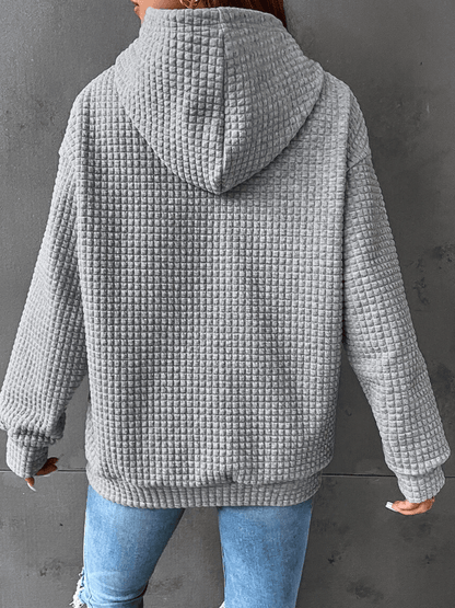 Sweat-shirt à capuche en tissu texturé gris, poche kangourou et cordons de serrage