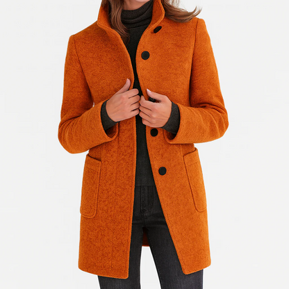 Manteau mi-long en laine orange à boutons, col montant et poches plaquées