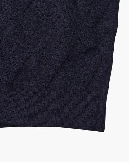 Gilet en tricot marine à motif losanges et manches côtelées