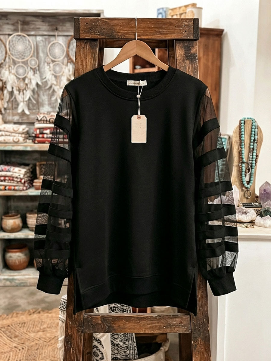 Pull noir en maille à manches en tulle transparentes à bandes, col rond
