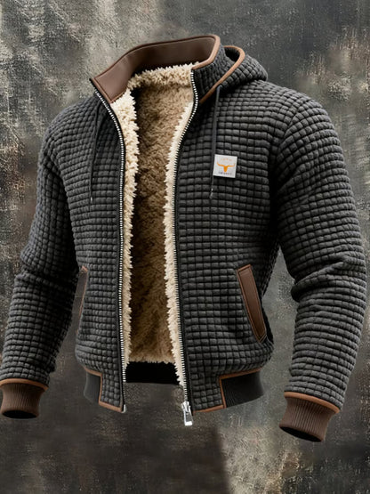 Veste bomber homme grise à capuche, doublure sherpa chaude, texture gaufrée.